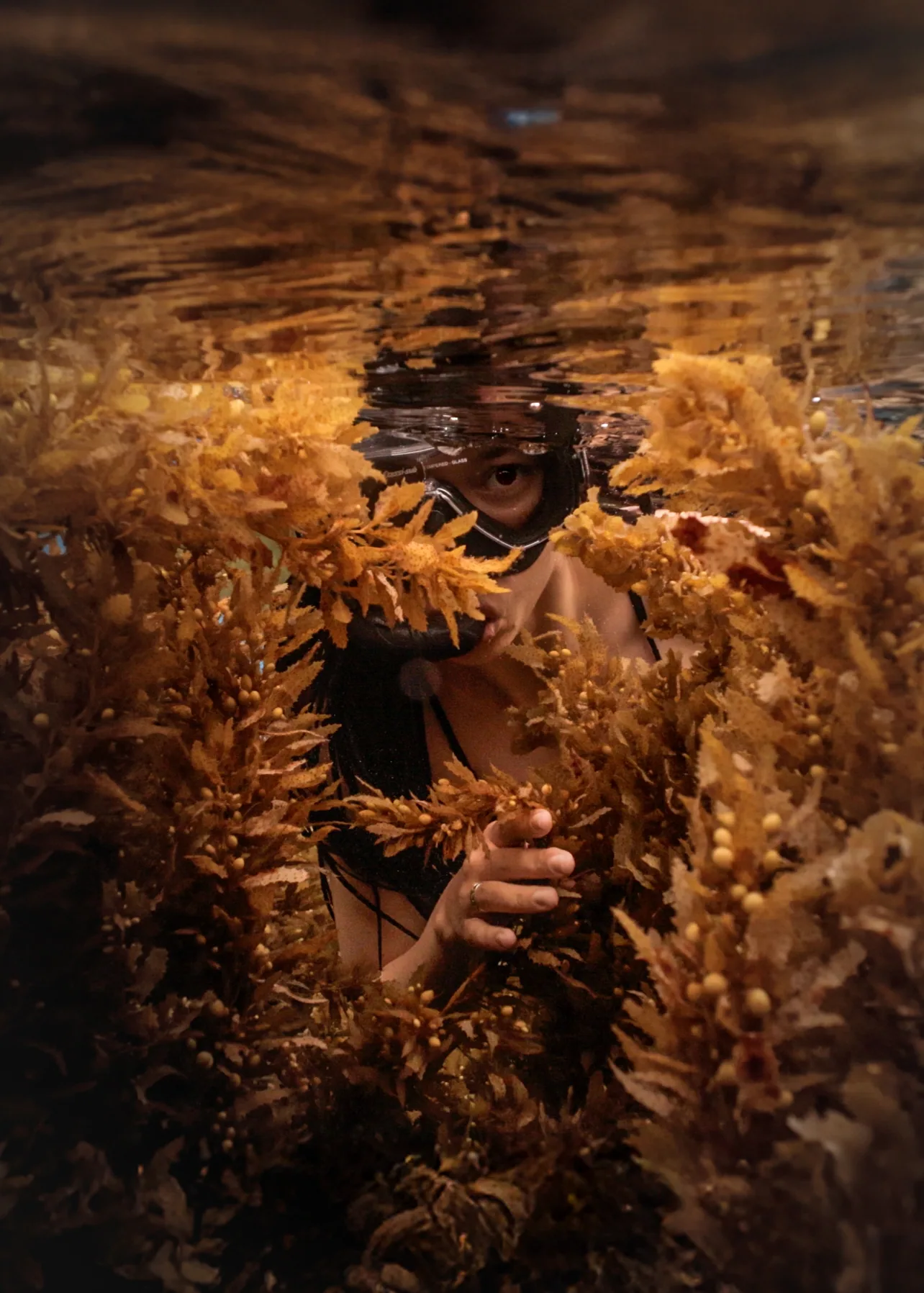 Underwater portrait of a female snorkeler in clear blue water